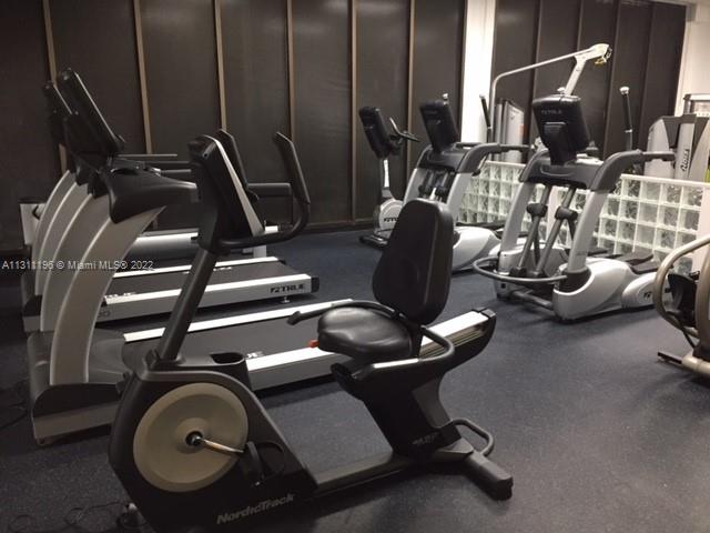 9511 Collins Avenue, Unit 1202 Surfside, FL 33154 - Photo 2 of 4 a view of a room with gym equipment