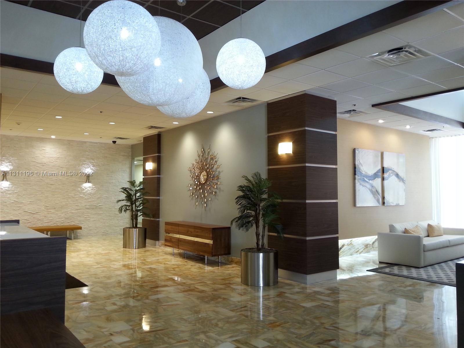 9511 Collins Avenue, Unit 1202 Surfside, FL 33154 - Photo 3 of 4 a view of a lobby area
