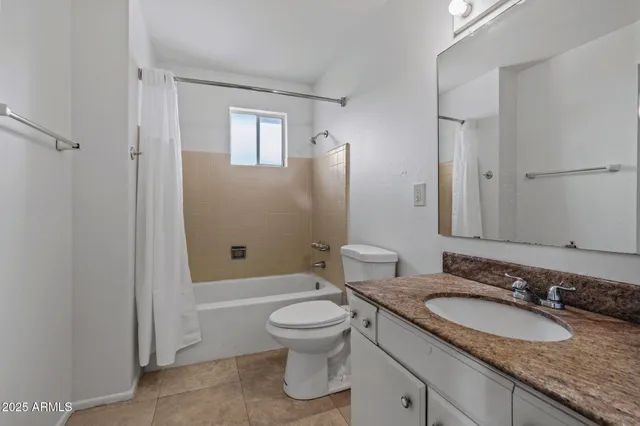 a view of backyard of house and trees