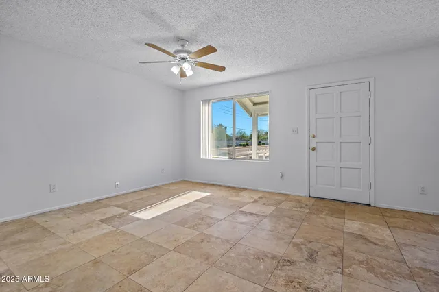 a view of an empty room with a window