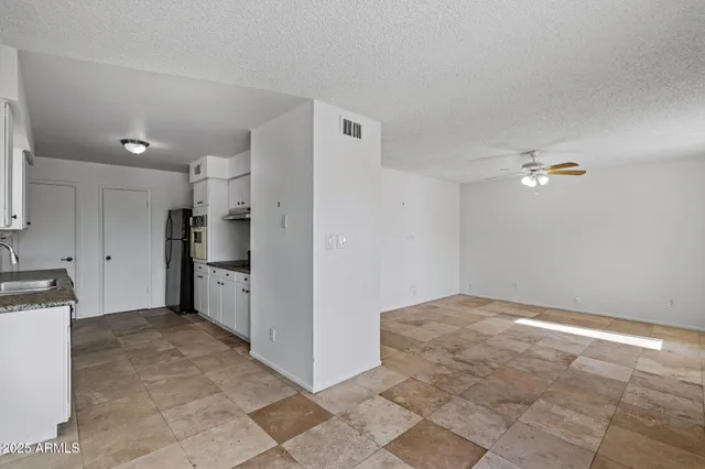 a view of a kitchen with a sink