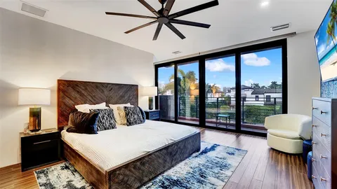 a living room with furniture a rug and a chandelier