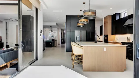 a view of a livingroom with furniture and a window