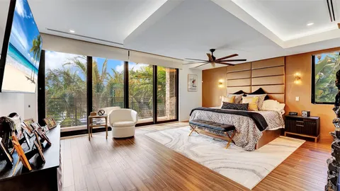 a kitchen with stainless steel appliances granite countertop a sink a stove a refrigerator and island