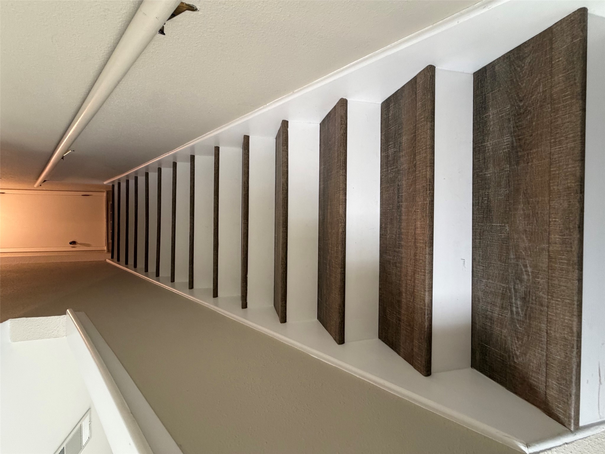 1401 Camp Craft Road, Unit C Austin, TX 78746 - Photo 12 of 12 Clean lines define this inviting staircase, guiding residents to the upper levels of the home.