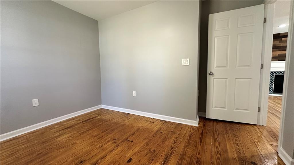 1770 Springview Road Northwest Atlanta, GA 30314 - Photo 12 of 30 wooden floor in an empty room
