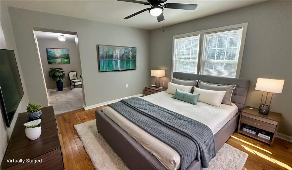 1770 Springview Road Northwest Atlanta, GA 30314 - Photo 14 of 30 a bedroom with a bed and a couch