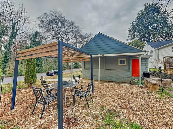 a patio with table and chairs