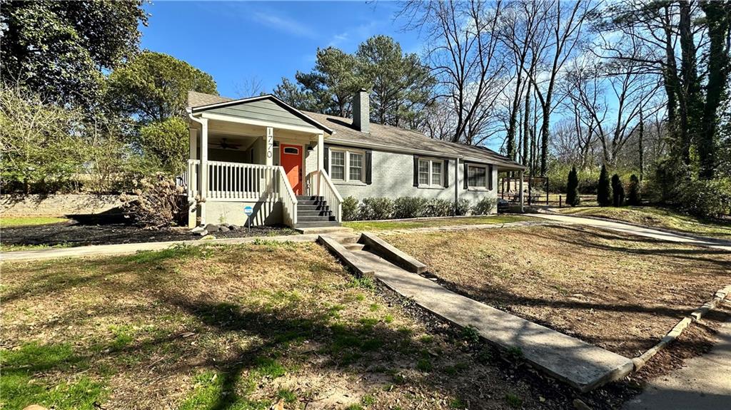1770 Springview Road Northwest Atlanta, GA 30314 - Photo 2 of 30 a front view of a house with a yard