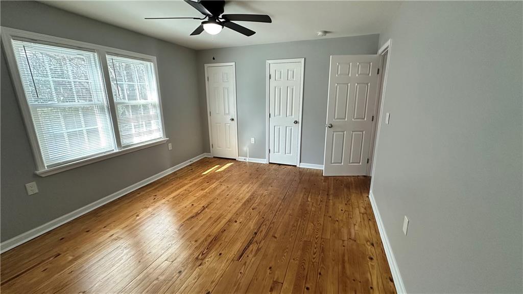 1770 Springview Road Northwest Atlanta, GA 30314 - Photo 22 of 30 a view of a livingroom with wooden floor and a window