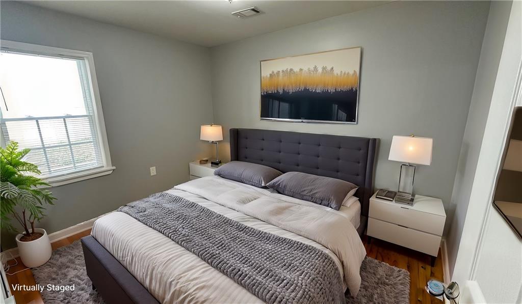1770 Springview Road Northwest Atlanta, GA 30314 - Photo 23 of 30 a bedroom with a bed and window