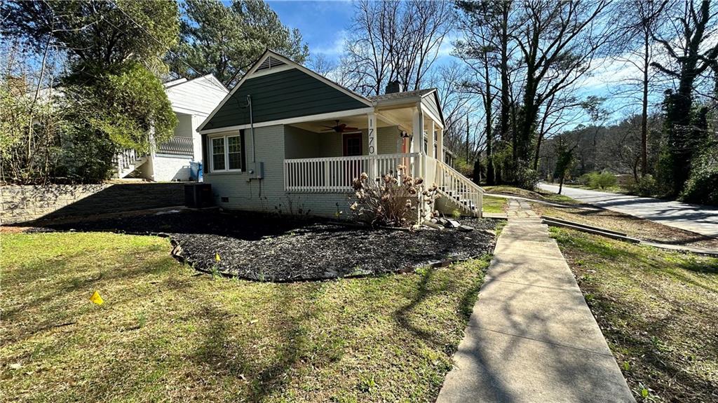 1770 Springview Road Northwest Atlanta, GA 30314 - Photo 3 of 30 a front view of a house with a yard