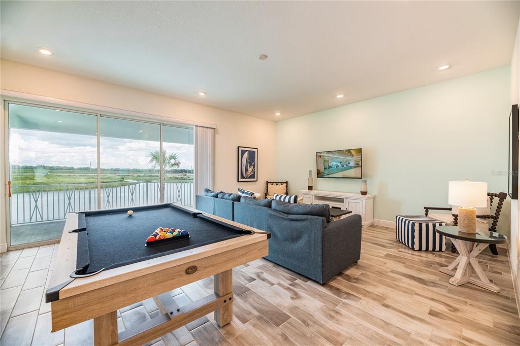 8145 Surf Street Kissimmee, FL 34747 - Photo 14 of 28 a living room with furniture and a large window