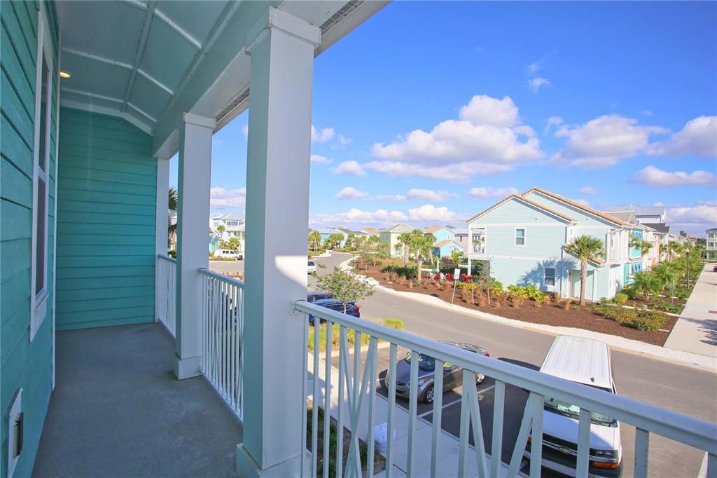 8145 Surf Street Kissimmee, FL 34747 - Photo 16 of 28 a view of a balcony with wooden floor and city view