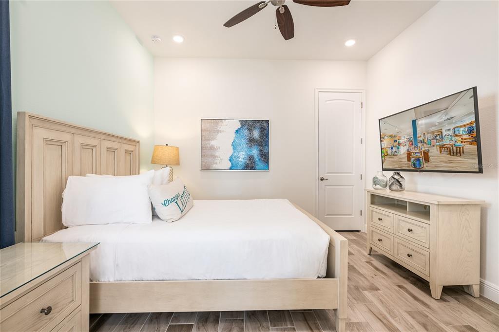 8145 Surf Street Kissimmee, FL 34747 - Photo 22 of 28 a bedroom with a bed and a dresser