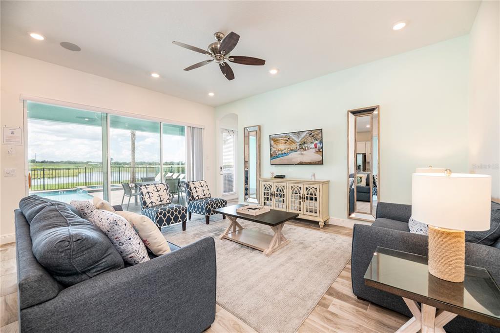 8145 Surf Street Kissimmee, FL 34747 - Photo 4 of 28 a living room with furniture and a large window