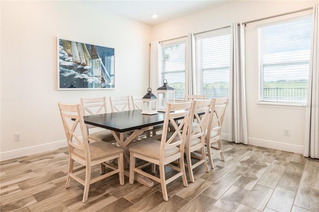 8145 Surf Street Kissimmee, FL 34747 - Photo 8 of 28 a dining room with furniture and window