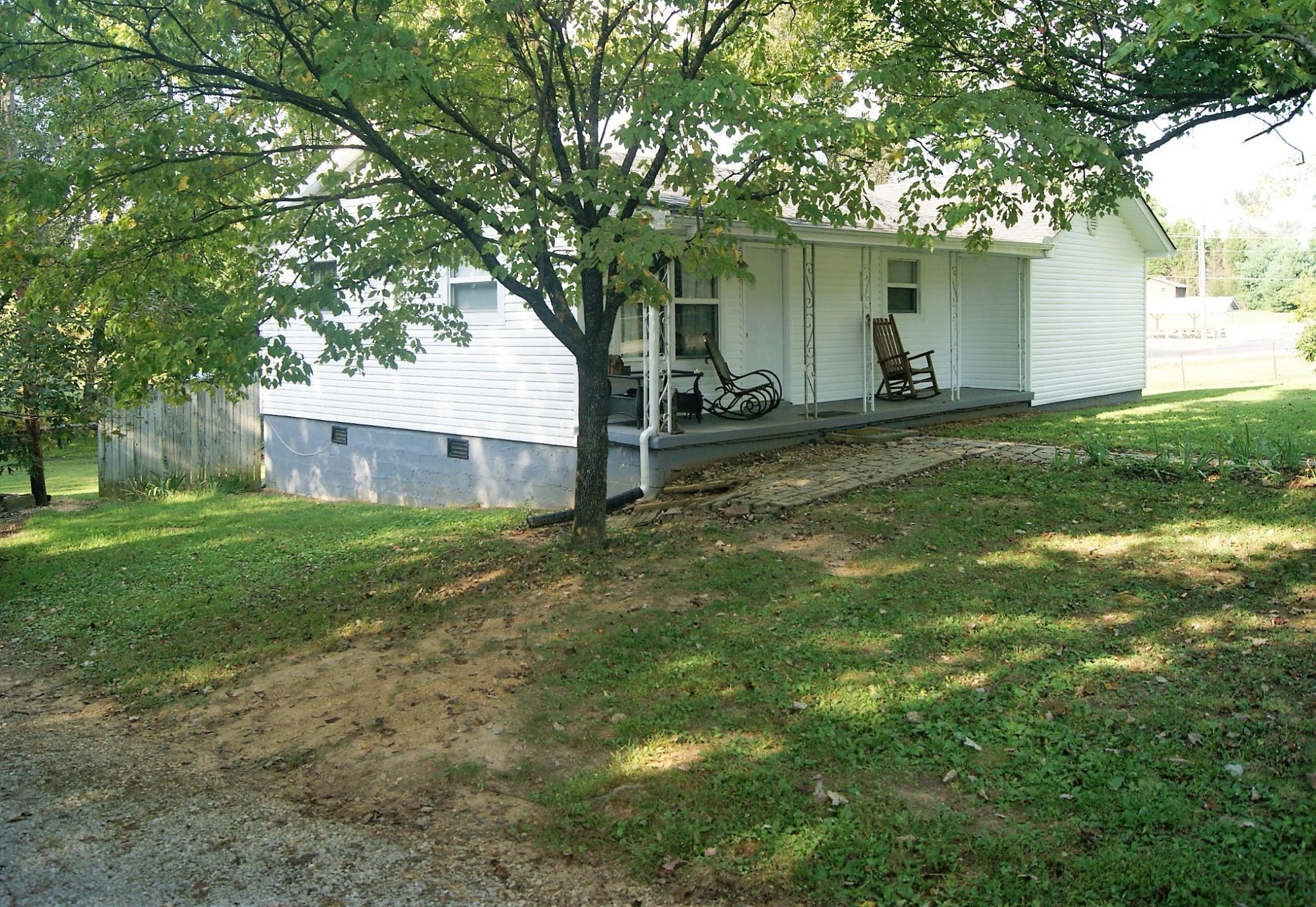 5552 Niles Ferry Road Greenback, TN 37742 - Photo 4 of 30 a view of a house with a yard and tree