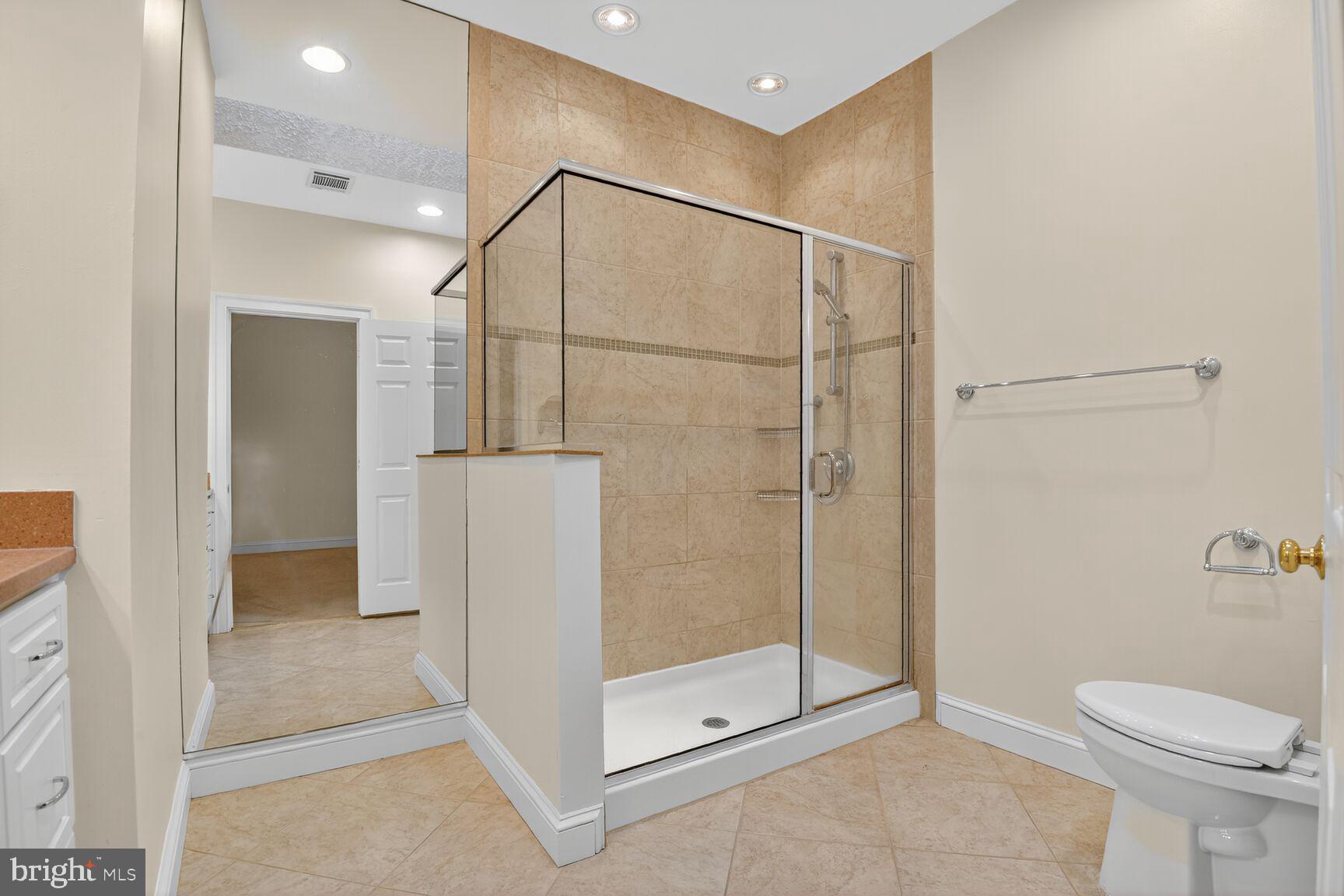 11405 Summer House Court Reston, VA 20194 - Photo 14 of 20 a bathroom with a shower and toilet