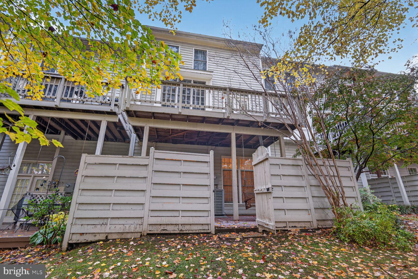 11405 Summer House Court Reston, VA 20194 - Photo 19 of 20 a front view of a house with a garden