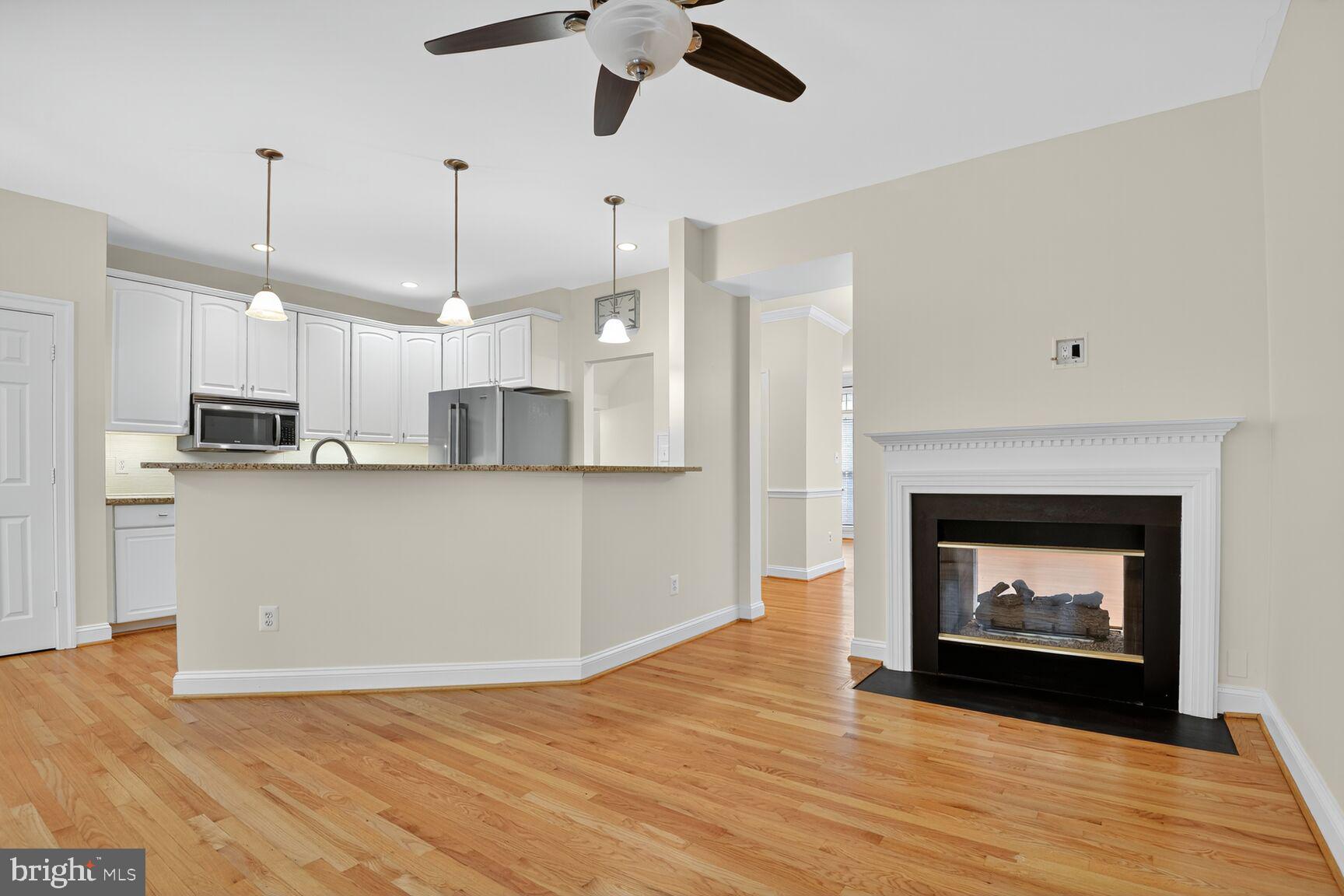 11405 Summer House Court Reston, VA 20194 - Photo 2 of 20 a view of kitchen with kitchen island wooden floor center island and appliances