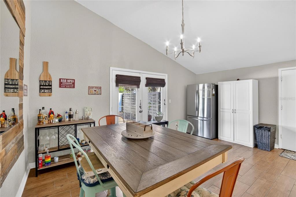 1009 Lenna Avenue Seffner, FL 33584 - Photo 11 of 68 a view of a dining room and livingroom with furniture wooden floor a chandelier