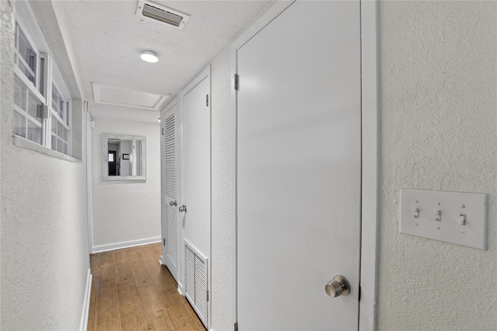 1009 Lenna Avenue Seffner, FL 33584 - Photo 16 of 68 a view of a hallway with wooden floor and closet