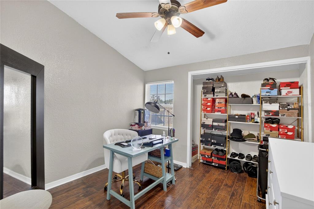 1009 Lenna Avenue Seffner, FL 33584 - Photo 20 of 68 a view of a workspace with furniture and wooden floor