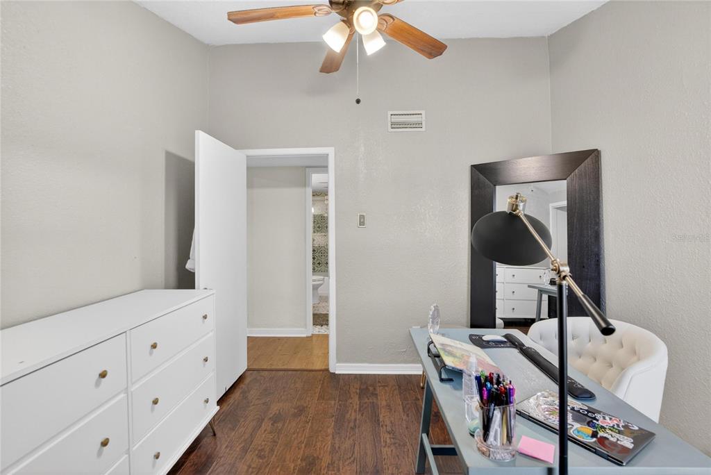 1009 Lenna Avenue Seffner, FL 33584 - Photo 22 of 68 a bedroom with a bed and wooden floor