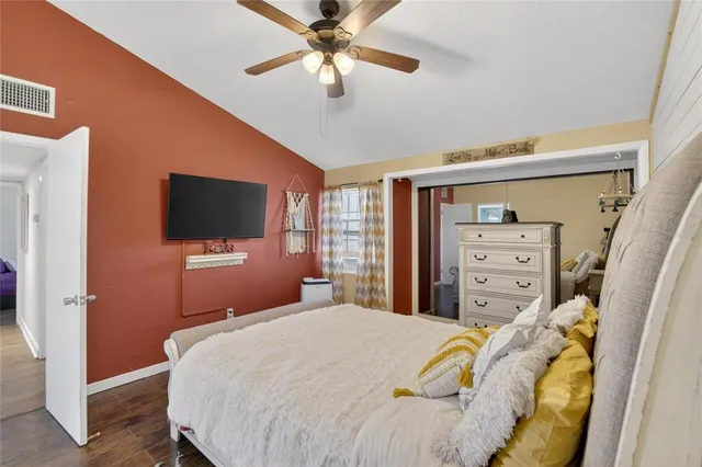 a spacious bathroom with a double vanity sink a toilet and a shower