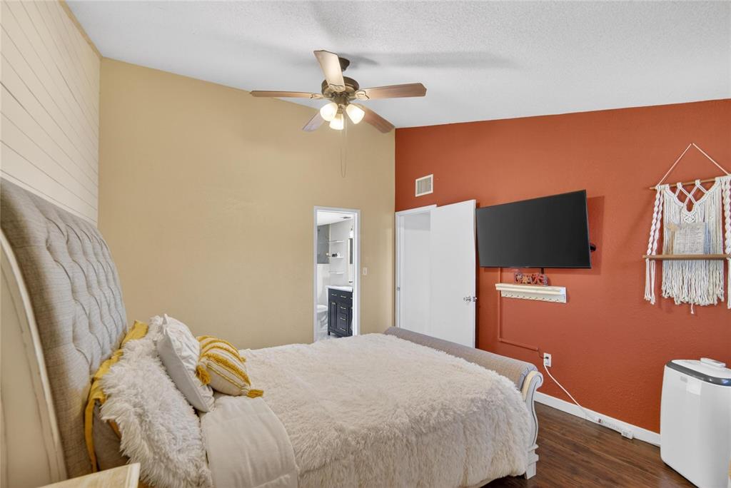 1009 Lenna Avenue Seffner, FL 33584 - Photo 27 of 68 a bedroom with a bed and a flat screen tv