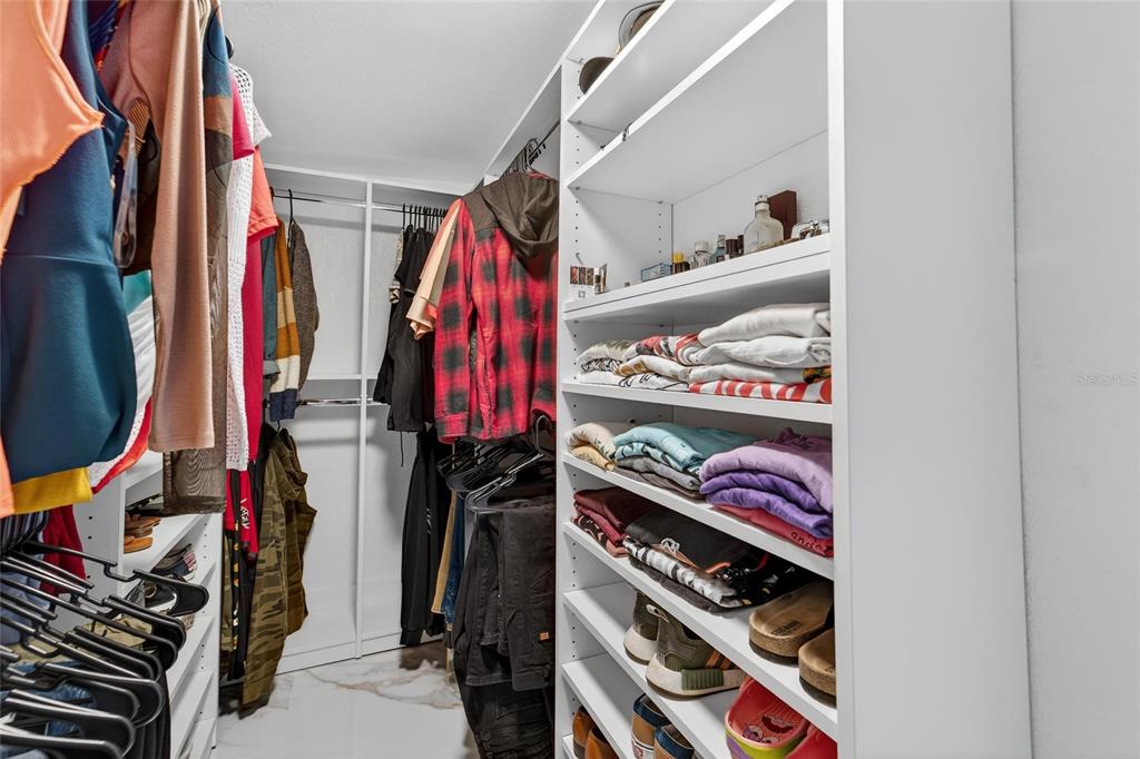 1009 Lenna Avenue Seffner, FL 33584 - Photo 37 of 68 a view of walk in closet with clothes