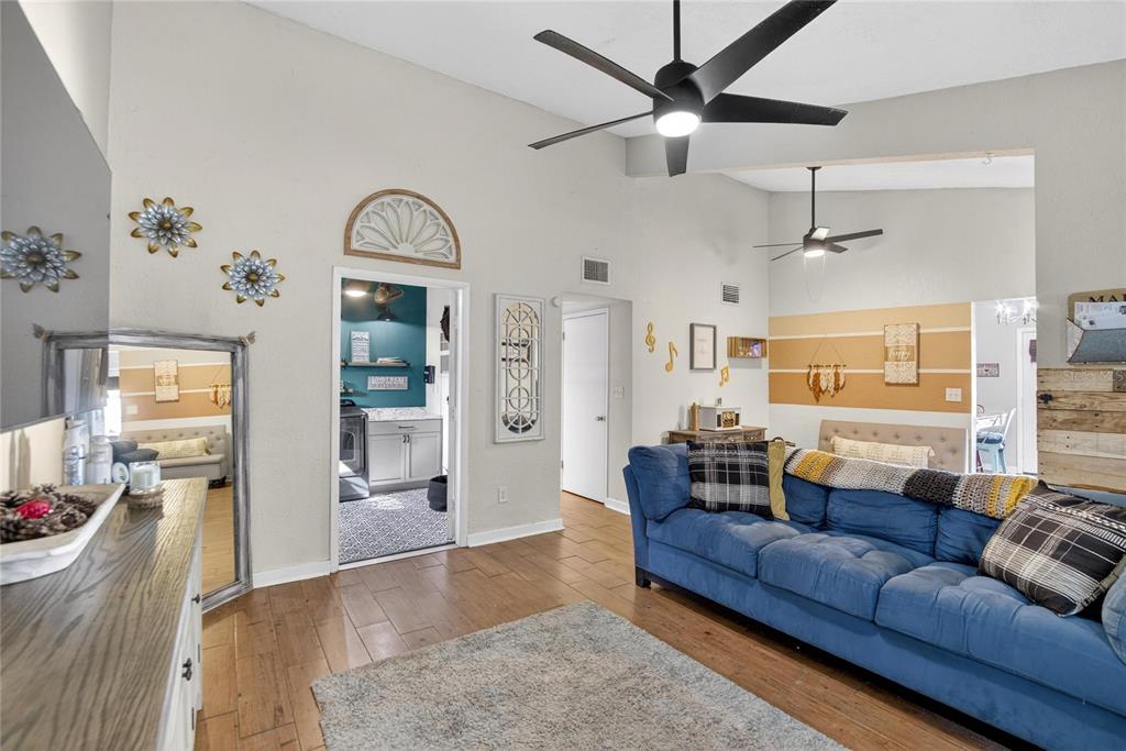 1009 Lenna Avenue Seffner, FL 33584 - Photo 5 of 68 a living room with furniture and wooden floor