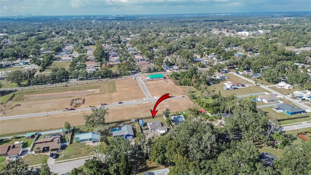 1009 Lenna Avenue Seffner, FL 33584 - Photo 64 of 68 an aerial view of a house with a yard and lake view