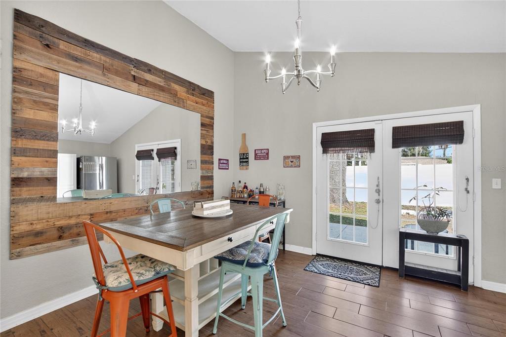 1009 Lenna Avenue Seffner, FL 33584 - Photo 9 of 68 a view of a dining room with furniture and wooden floor