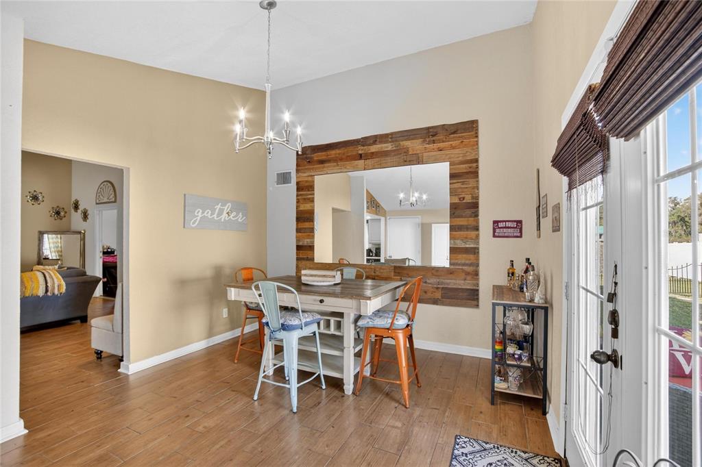 1009 Lenna Avenue Seffner, FL 33584 - Photo 10 of 68 a view of a dining room with furniture window and wooden floor