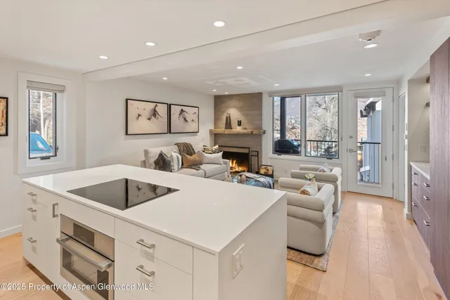 a view of kitchen island a sink and living room