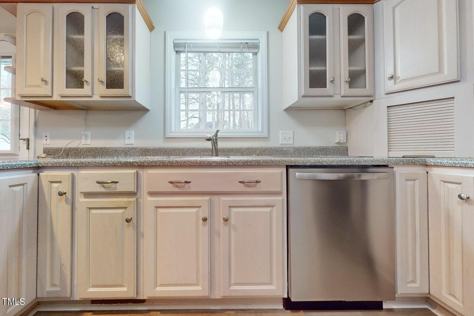 131 Brookfield Circle Sanford, NC 27330 - Photo 14 of 46 a kitchen with granite countertop white cabinets and window