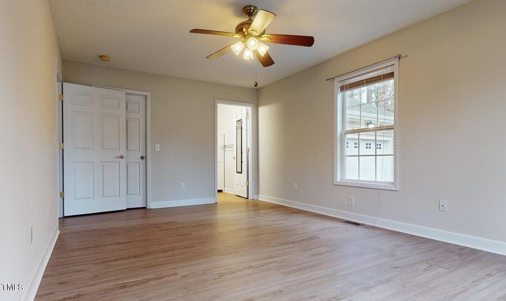 131 Brookfield Circle Sanford, NC 27330 - Photo 18 of 46 wooden floor in an empty room with a window