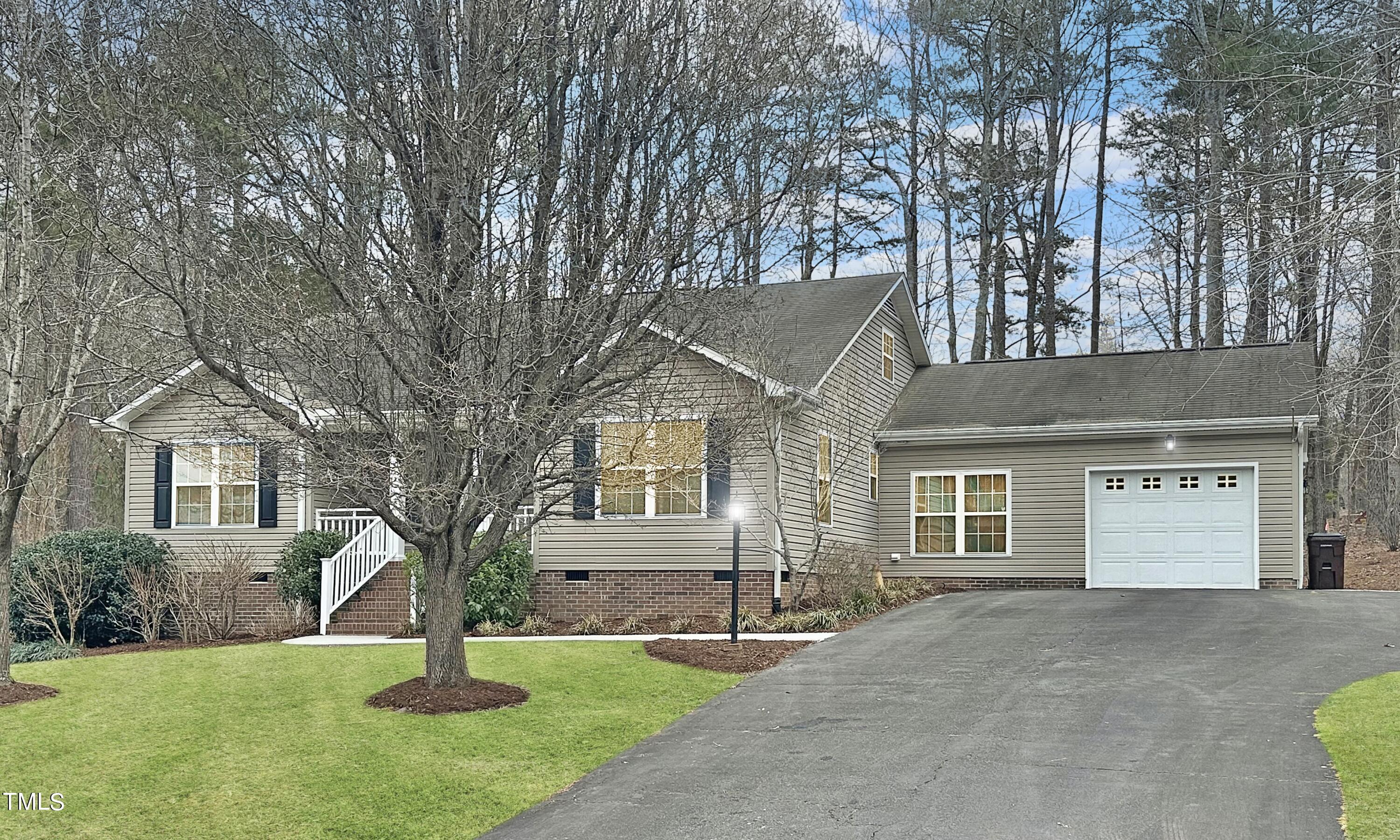 131 Brookfield Circle Sanford, NC 27330 - Photo 2 of 46 front view of a house with a yard