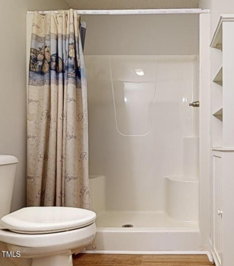 131 Brookfield Circle Sanford, NC 27330 - Photo 21 of 46 a bathroom with a toilet and a shower