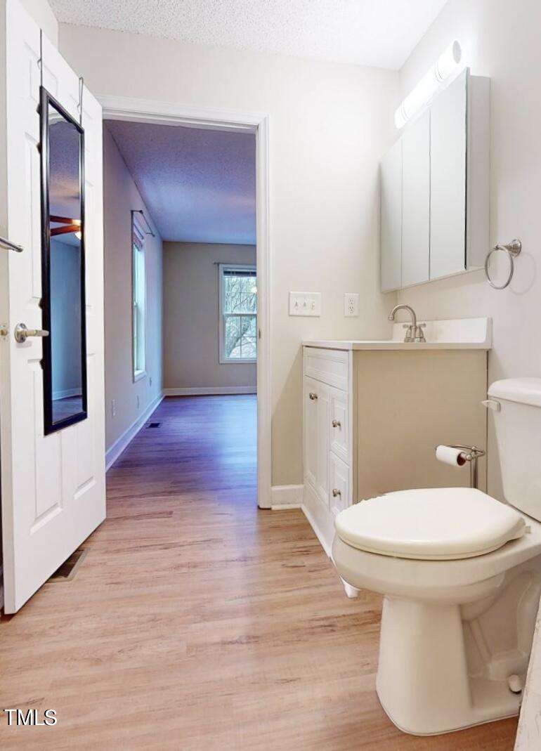 131 Brookfield Circle Sanford, NC 27330 - Photo 22 of 46 a bathroom with a toilet sink and mirror