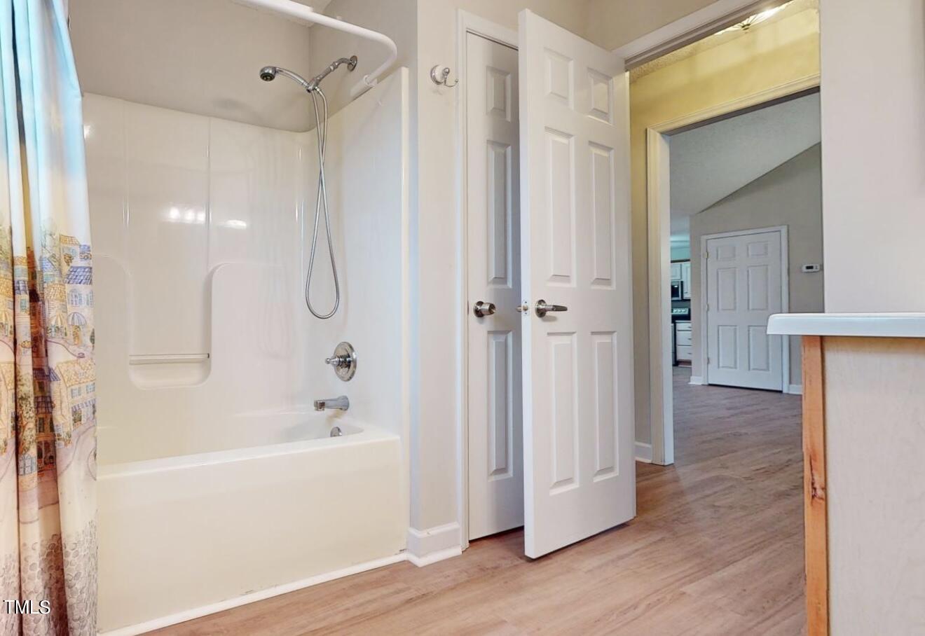 131 Brookfield Circle Sanford, NC 27330 - Photo 27 of 46 a bathroom with a bathtub and a shower