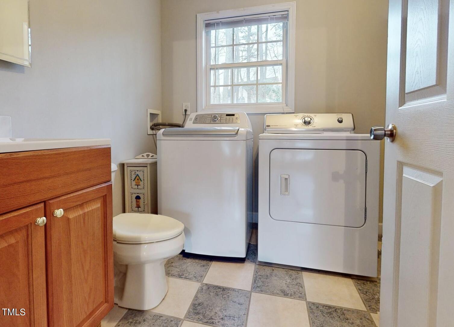 131 Brookfield Circle Sanford, NC 27330 - Photo 36 of 46 a utility room with dryer and washer