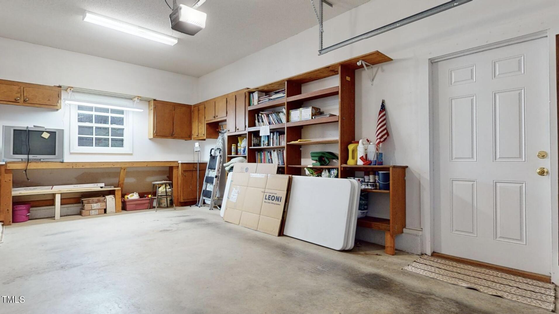 131 Brookfield Circle Sanford, NC 27330 - Photo 40 of 46 a living room with furniture and a book shelf