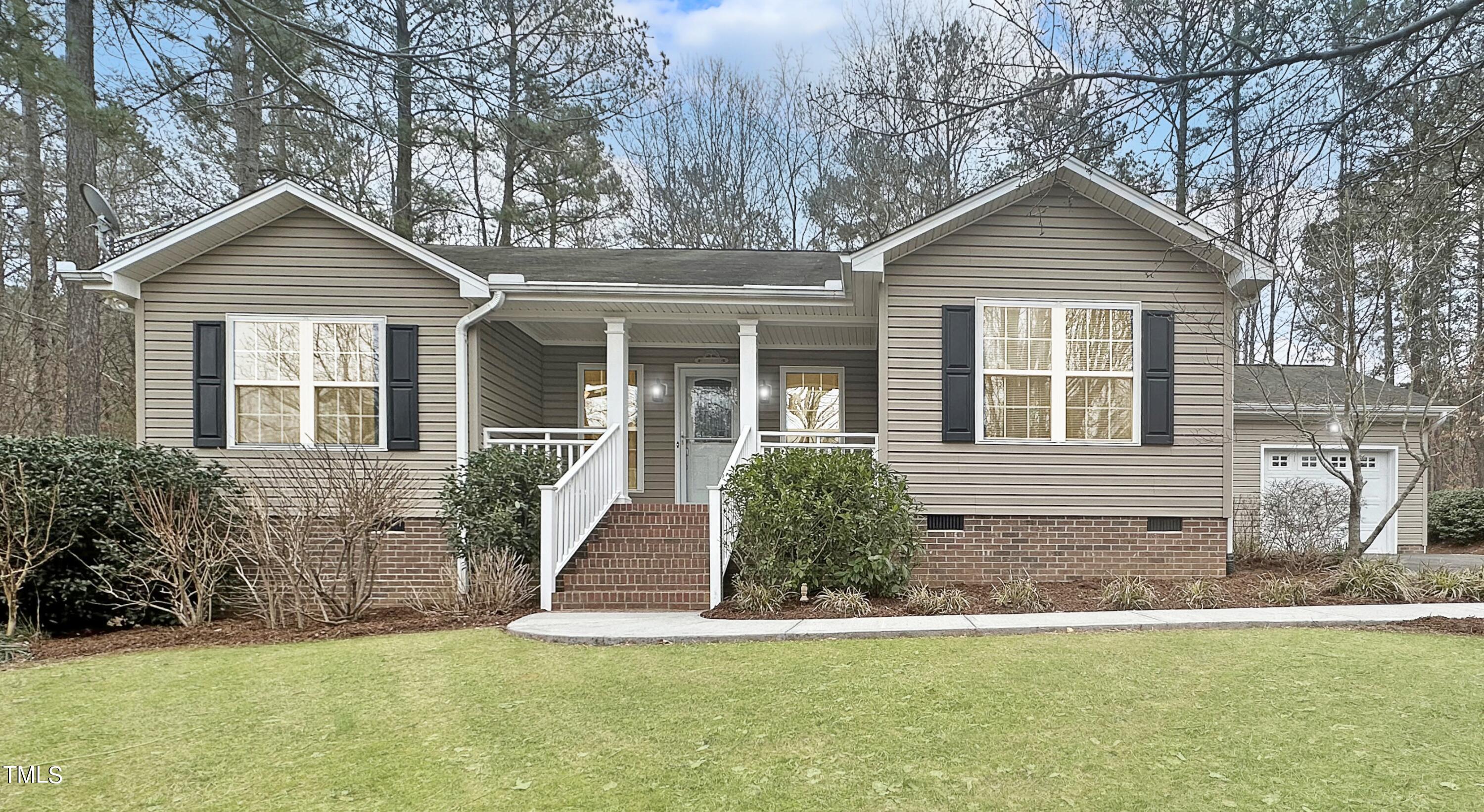 131 Brookfield Circle Sanford, NC 27330 - Photo 4 of 46 a front view of a house with a yard