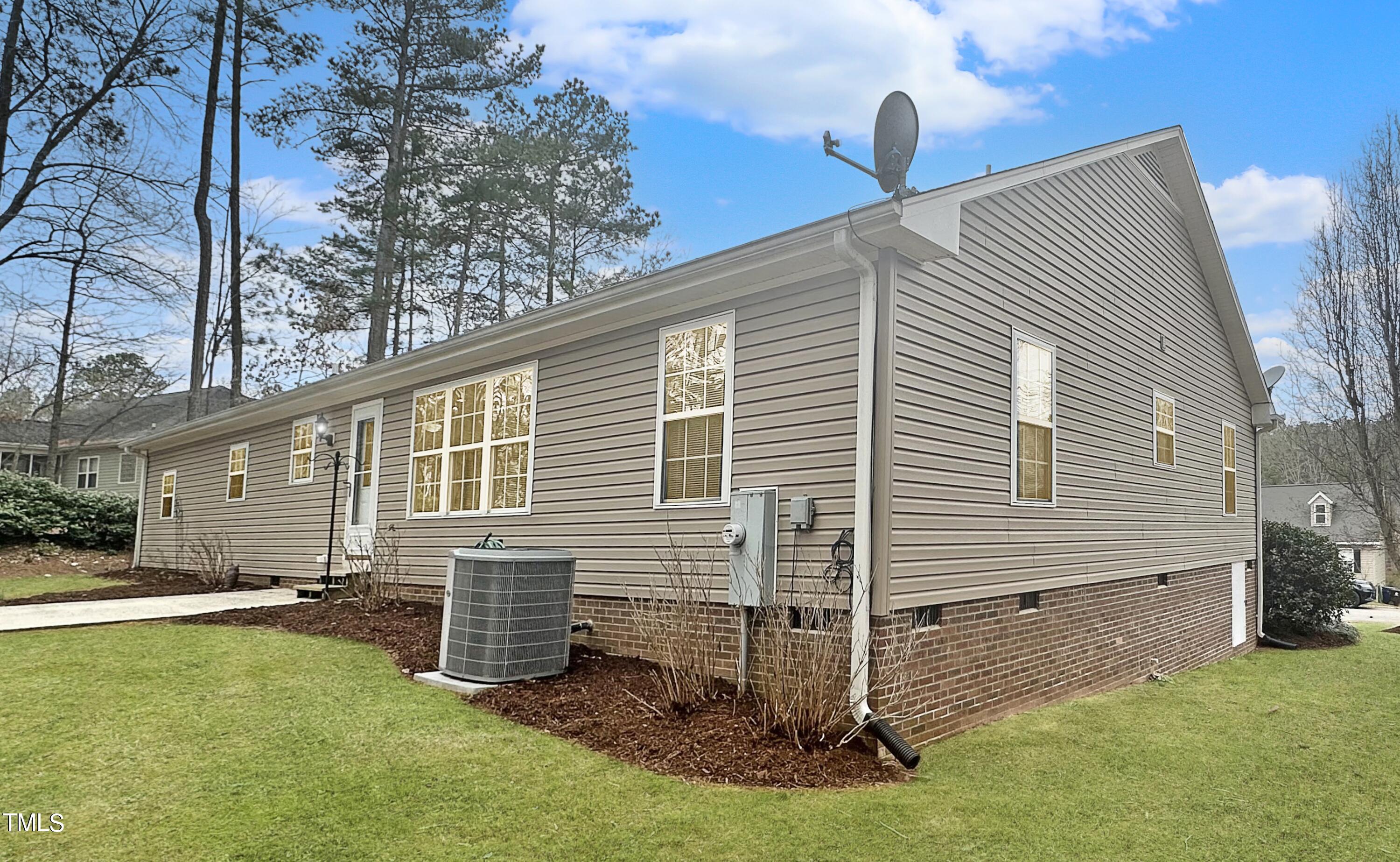 131 Brookfield Circle Sanford, NC 27330 - Photo 42 of 46 a front view of a house with garden