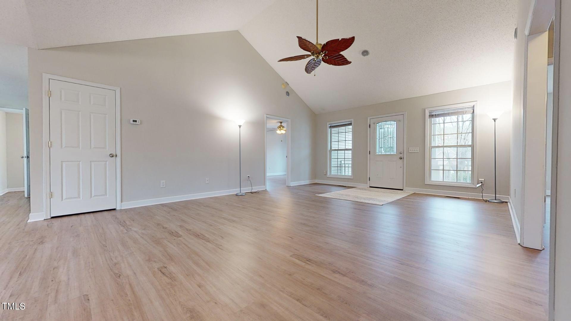 131 Brookfield Circle Sanford, NC 27330 - Photo 5 of 46 a view of an empty room with wooden floor and a window