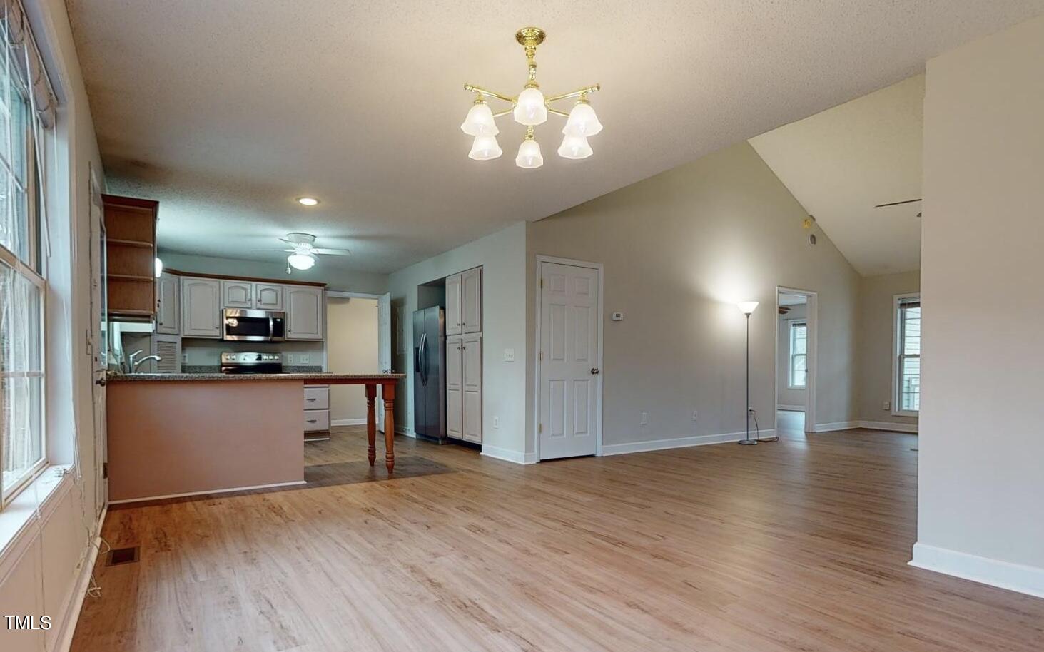 131 Brookfield Circle Sanford, NC 27330 - Photo 10 of 46 a view of a kitchen with a sink a refrigerator and a stove