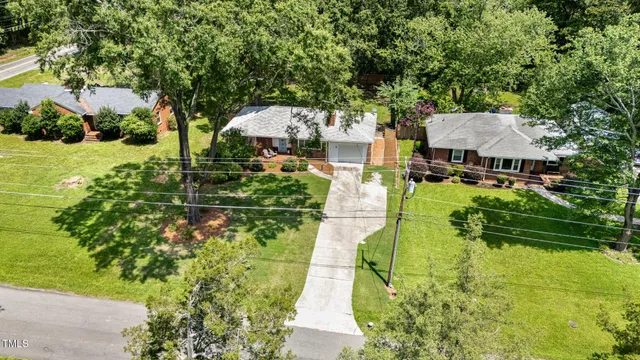 a view of yard with swimming pool and green space